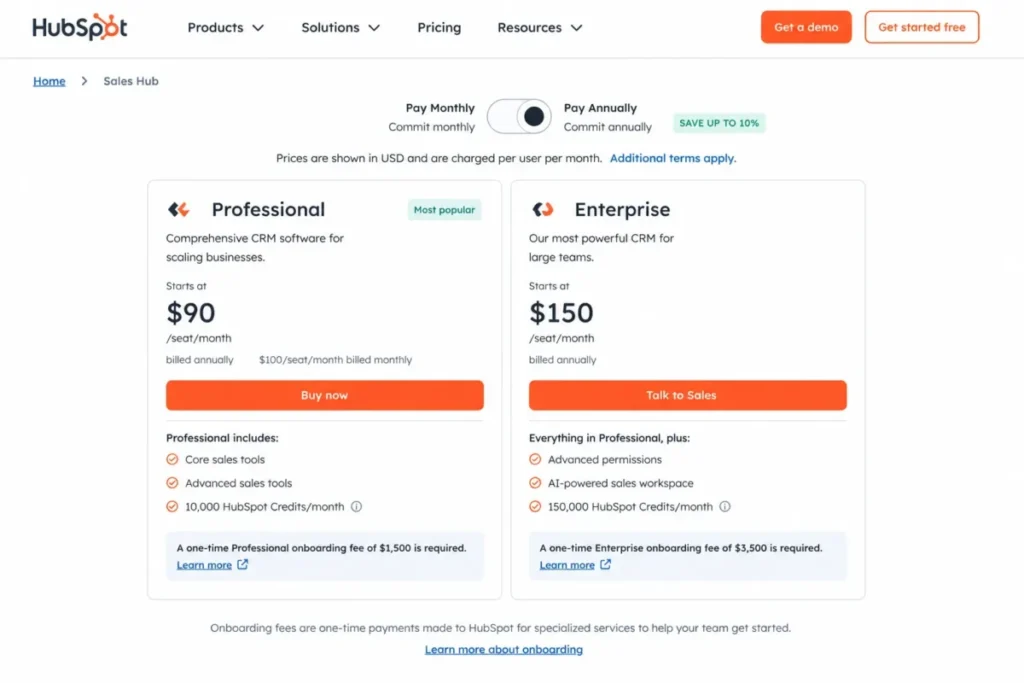 HubSpot Sales Hub pricing page showing Professional at $90 per seat monthly and Enterprise at $150, with mandatory onboarding fees.