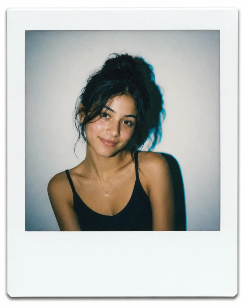 Gemini AI Photo Prompt Copy Paste example showing an instant film portrait with a wide white border, hard flash shadow, and cyan color shift