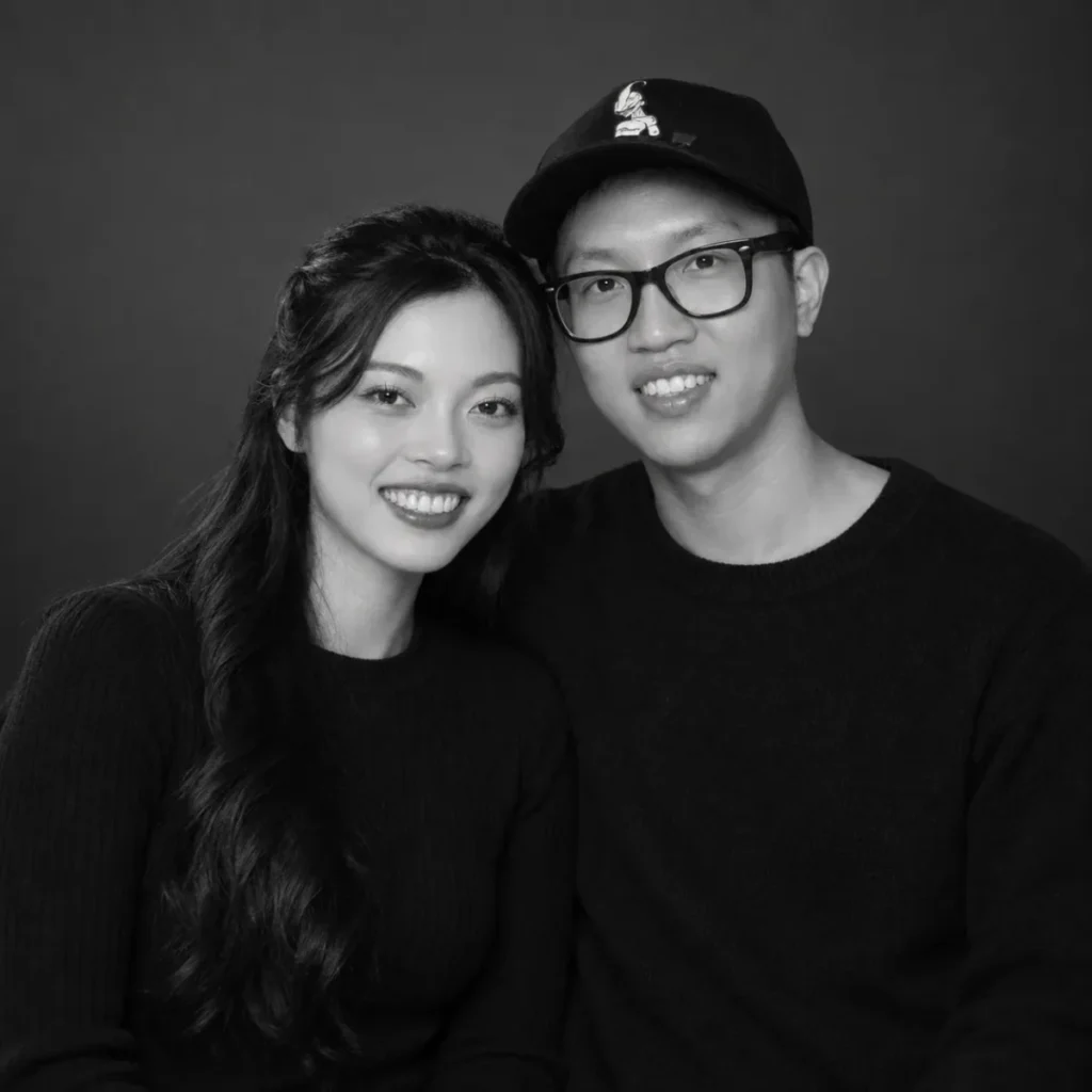 Gemini Couple Photo Prompts example of a couple in a black and white waist-up studio portrait with shoulders touching and calm expressions